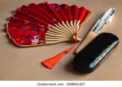 Red Fan And Black Glasses Case