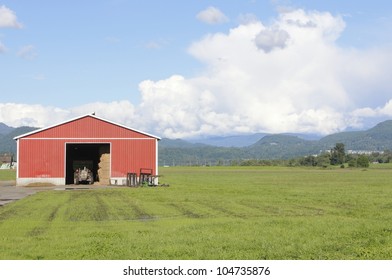 A red farm shed and tractor beside a field/Field and farm shed/Red Farm Shed and Field