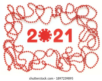 Red Felt Year Numbers 2021 On White Background. Zero In The Form Of A Covid Virus. Red Beads Around. Flat Lay For Valentine's Day Of New Year. Review Of The Coronavirus Year.