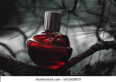 Red Female Perfume At Nature Background 