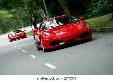 Red Ferrari F430 on the road in Singapore