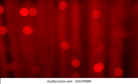 Red Festive Christmas Beautiful Abstract Blurred Background With Bokeh Lights. Holiday Background With Copy Space. Wide Screen, Defocused