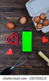 Red Festive Ingrediens For Cooking, Valentines Day Eggs, Rolling Pin And Whisk, Cutter Dish Shape Heart For Baking Cake Flat Lay, Chroma Key Smart Phone Copy Space.