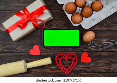 Red Festive Ingrediens For Cooking, Valentines Day Eggs, Rolling Pin And Whisk, Cutter Dish Shape Heart For Baking Cake Flat Lay, Chroma Key Smart Phone Copy Space.