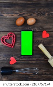 Red Festive Ingrediens For Cooking, Valentines Day Eggs, Rolling Pin And Whisk, Cutter Dish Shape Heart For Baking Cake Flat Lay, Chroma Key Smart Phone Copy Space.