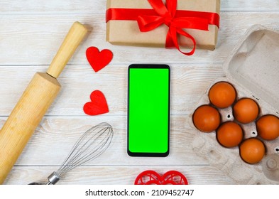 Red Festive Ingrediens For Cooking, Valentines Day Eggs, Rolling Pin And Whisk, Cutter Dish Shape Heart For Baking Cake Flat Lay, Chroma Key Smart Phone Copy Space.