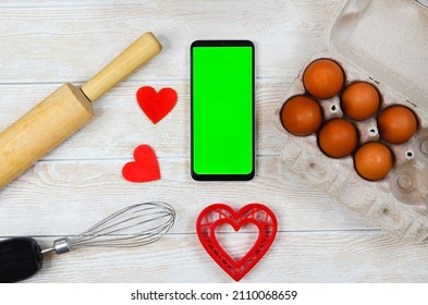 Red Festive Ingrediens For Cooking, Valentines Day Eggs, Rolling Pin And Whisk, Cutter Dish Shape Heart For Baking Cake Flat Lay, Chroma Key Smart Phone Copy Space.