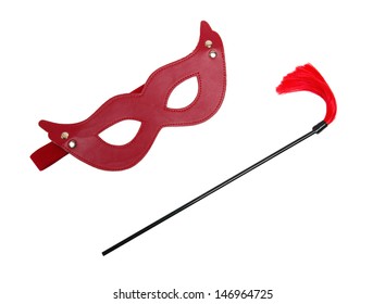 Red Fetish  Mask And A Whip Isolated On White Background