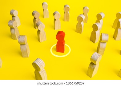 Red Figurine Of A Man In A Circle In Crowd Of People. Personal Space, Comfort Zone. Maintaining Distance To Avoid Contact And Infection. Identification Of Infected Persons And Isolation From Society.