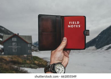 Red Filed Notes diary on mountains landscapes background