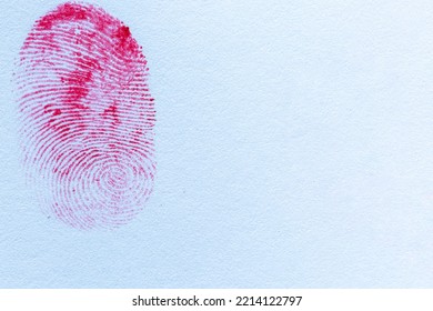 Red Fingerprint On White Paper