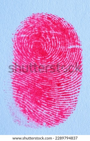 Red fingerprint,Red fingerprint on white paper,Bloody fingerprint as background, macro. Imprint of index finger