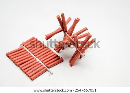 Red fire crackers string isolated over white background. Festival or celebration decoration equipment