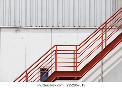 Red Fire Exit Stair Of Industry Factory, Outdoor Fire Escape Ladder Of Warehouse.