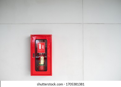 Red Fire Extinguisher Cabinet On The Wall