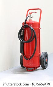 Red Fire Extinguisher Ready In Case Of Emergency Fire In A Public Building