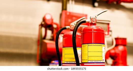 The Red Fire Extinguisher Is Ready For Use In Case Of An Indoor Fire Emergency.