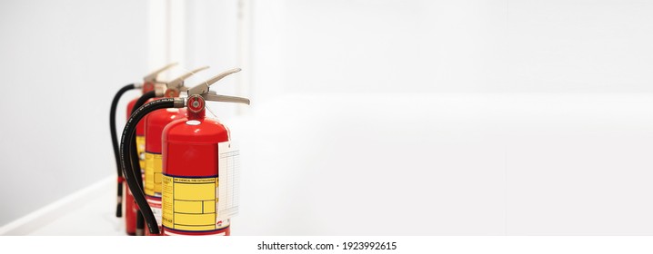 The Red Fire Extinguisher Is Ready For Use In Case Of An Indoor Fire Emergency.