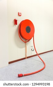 Red fire hose in building to fight a fire