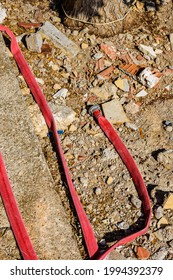 Red Fire Hose With Fitting On A Ground