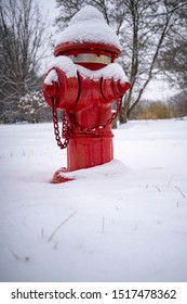 Red Fire Hydrant Covered in Snow in Winter