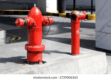 Red fire hydrant in front of a building