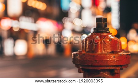 Red fire hydrant, a fire hydrant on the street with bokeh in background