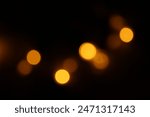 Red and fire orange bokeh on a black background, bokeh abstract background, modern technological abstract background. Orange Christmas background, Xmas backdrop
