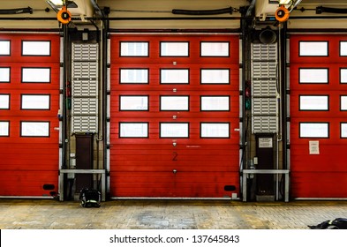 Red Fire Station Doors Closed At A Fire Station In England, UK