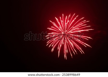 red firework explode night sky