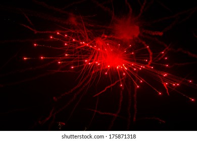 red firework exploding in night