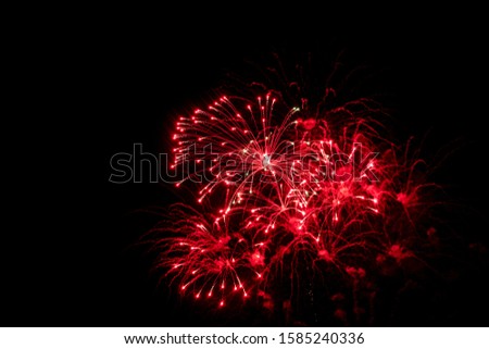Red fireworks on black background for winter and new year festivals