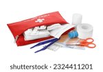 Red first aid kit with scissors, pins, cotton buds, pills, plastic forceps, medical plasters and elastic bandage isolated on white