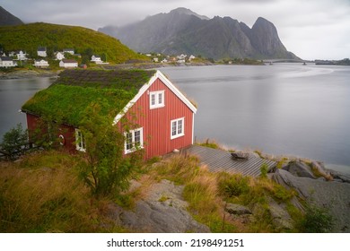 Red Fishermen Cabin In The Fishing Village Of Reine In Lofoten Islands, Norway