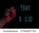 red fist black background with text fight ten cents. $0.10 say no to the new pricing system of shutterstock that  exploits contributor