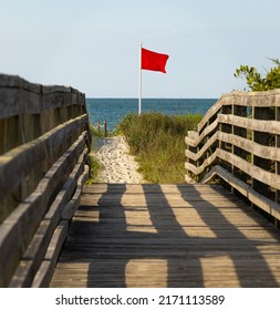 Red Flag Riptide Warning On The Beach