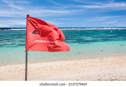 Red Flag Warning On Sandy Beach In Bali