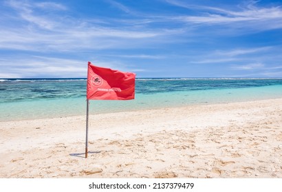 Red Flag Warning On Sandy Beach In Bali