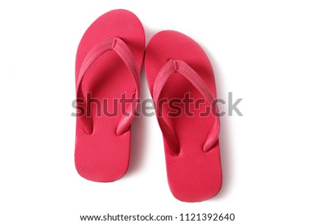 Red flipflops beach sandals isolated on white background