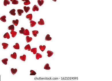 Red Foil Heart Shaped Confetti Isolated On White Backround. Valentine's Day Template With Copy Space