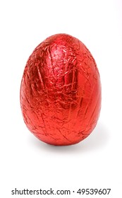 Red Foil Wrapped Chocolate Easter Egg Isolated Against White Background