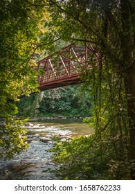 A Red Footbridge Over The Tulpehocken Creek In Reading, PA