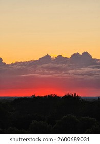 A red, foreboding, ominous sunset captured from an apartment.