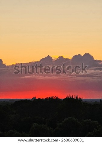 A red, foreboding, ominous sunset captured from an apartment.