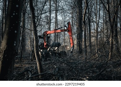 red forlkift and crane of woodcutter  i a forest in winter - Powered by Shutterstock