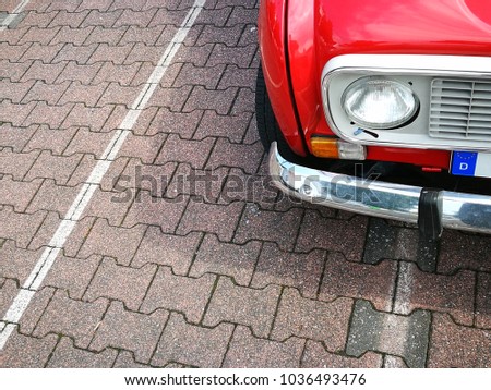 Red french small car of the seventies and eighties with chrome bumper in Schloss Holte-Stukenbrock in East Westphalia, Germany