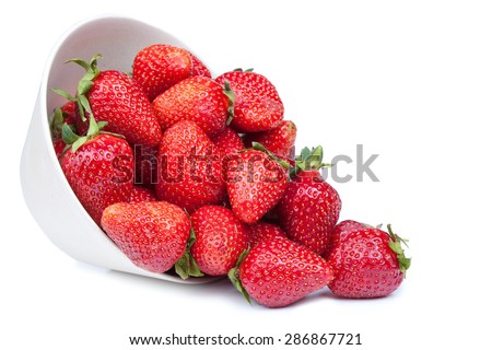 Red fresh strawberry in a bowl isolated on white background