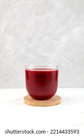 Red Fruit  Berry Smoothie In Clear Glass On Grey Background. Refreshing Healthy Cocktail, Antioxidant Slush Drink.