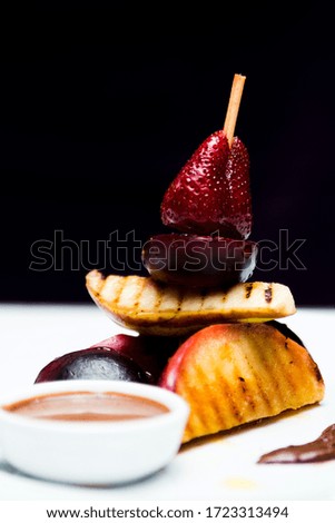 Similar – Image, Stock Photo Assorted gourmet pastries with fresh fruit toppings