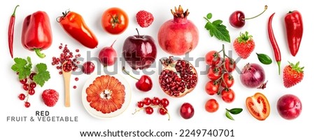 Red fruit and vegetable mix collection. Pomegranate, tomato, apple, pomelo, radish, currant, plum, cherry, strawberry, raspberry, onion, pepper isolated on white background. Flat lay, top view
